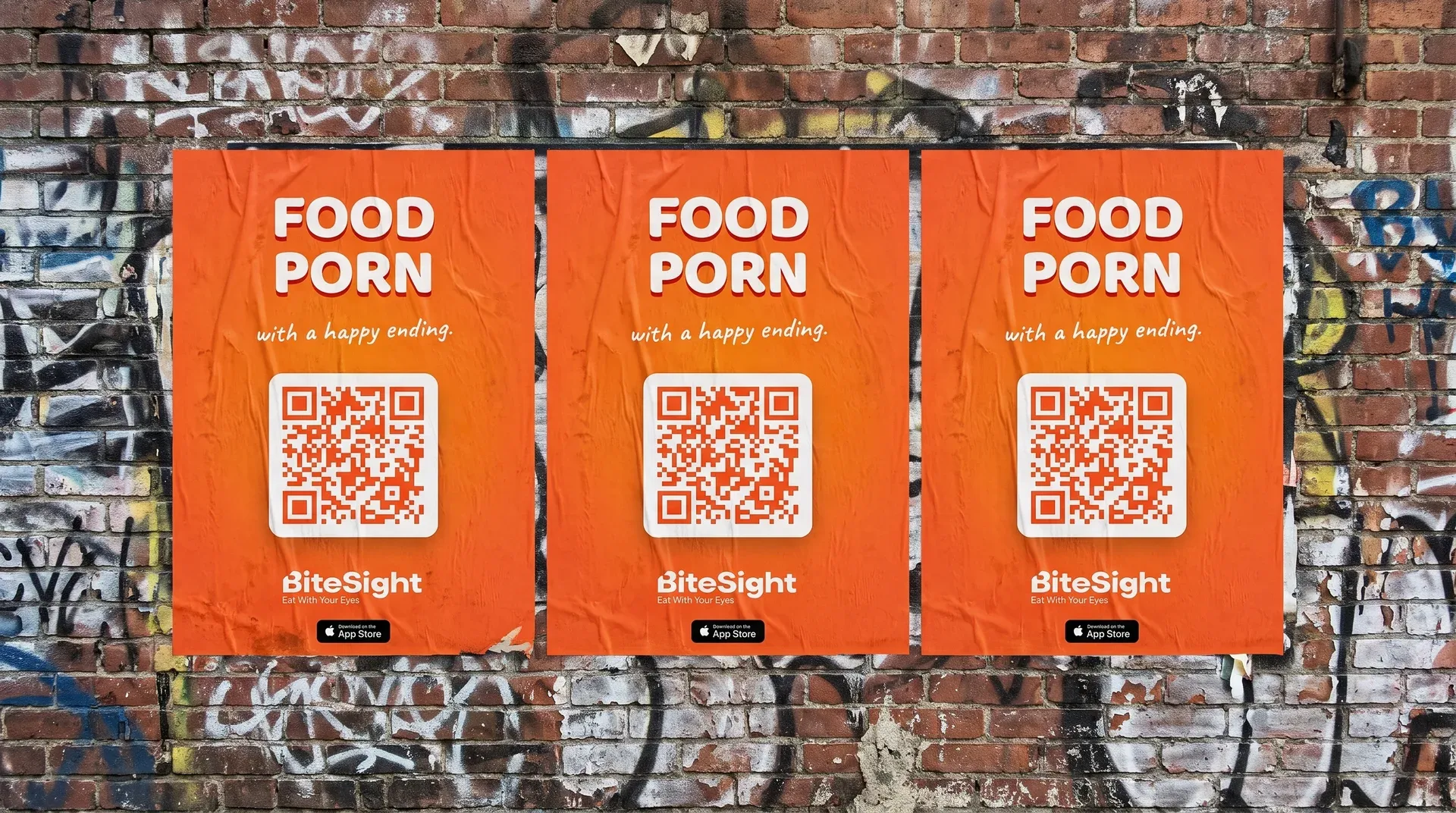 BiteSight street posters wheatpasted in a row on a New York brick wall
