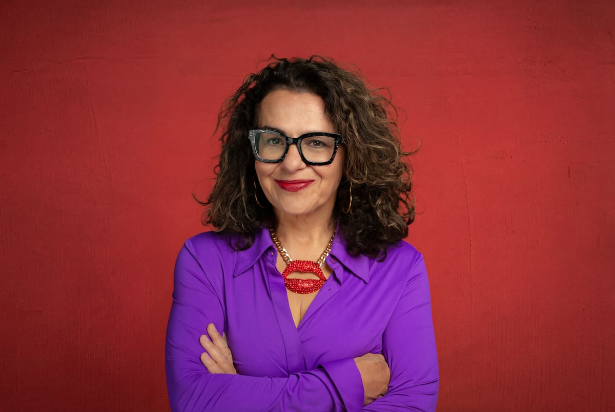 Cindy Friedman in a purple shirt with red lips
